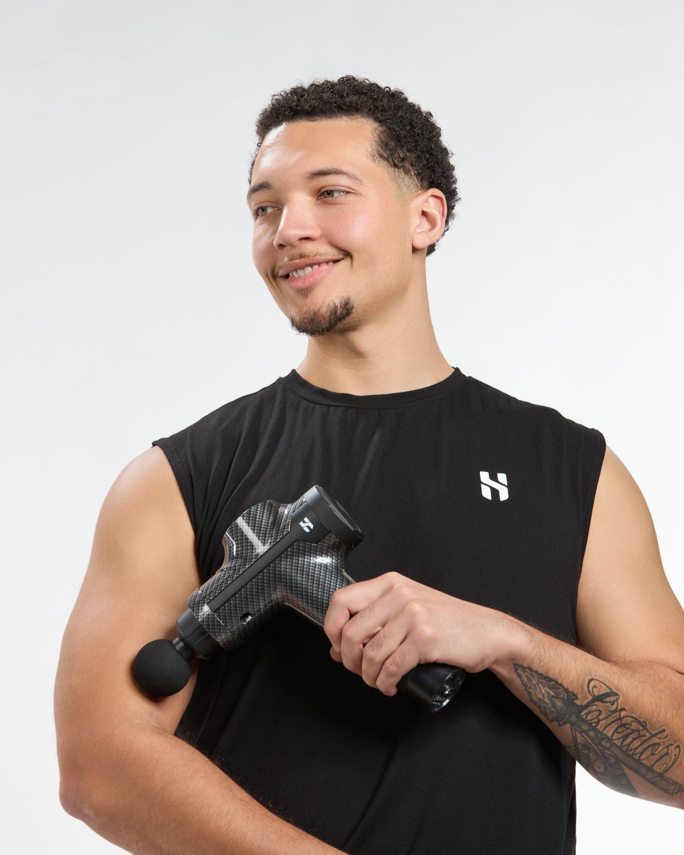 Stallion Collins, Founder Hamptons Stretch using Tensionhawk pro to relieve muscle pain